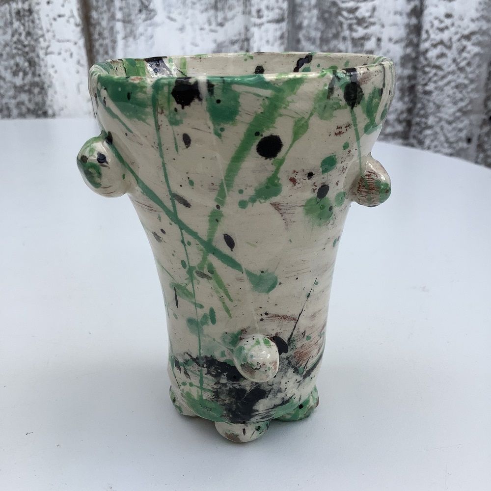 textured pot painted white with green and blue splatters