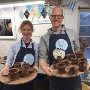 a couple gift each other a potter's wheel experience at eastnor pottery for valentines