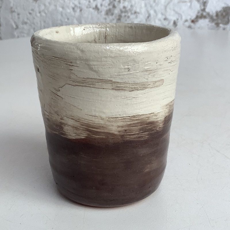 black and white ombre effect white to black beaker made on pottery course at eastnor pottery