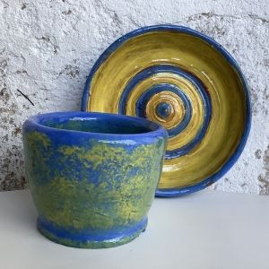 yellow and blue bowl and plate made by participants on a pottery course in eastnor herefordshire