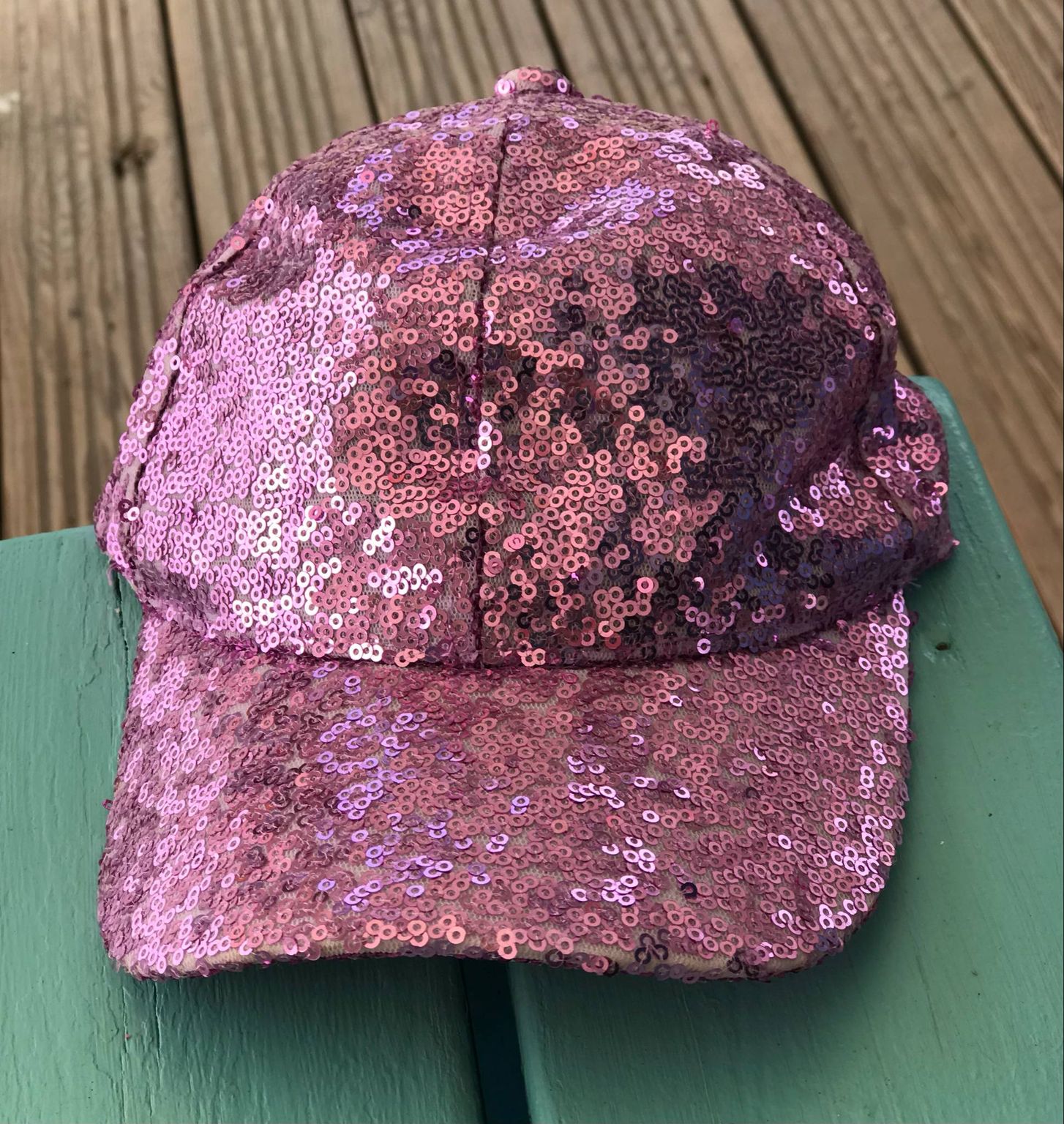 bright pink child's cap covered in pink shiny sequins at eastnor pottery