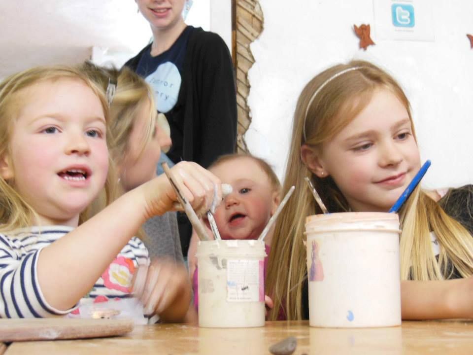 family painting their pottery rabbits theyve made at eastnor pottery