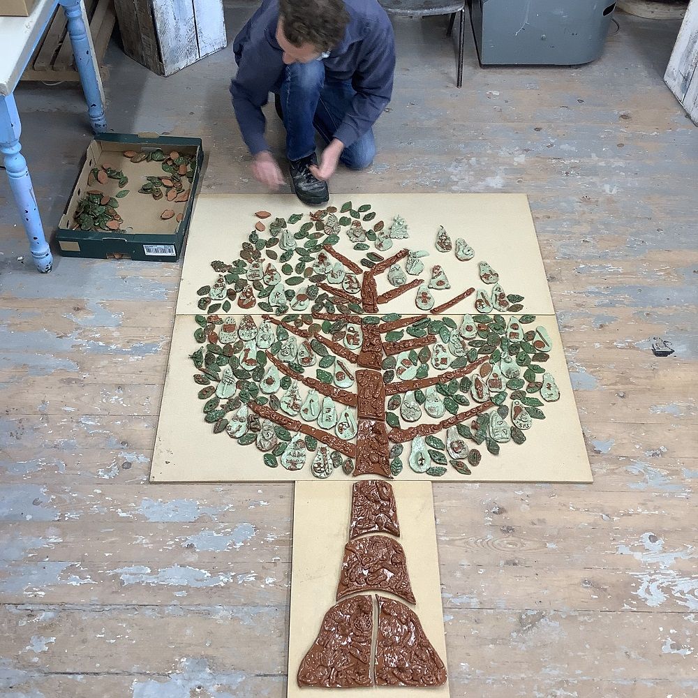 jon the potter assembling school project tile panel made with the orchards school in worcestershire