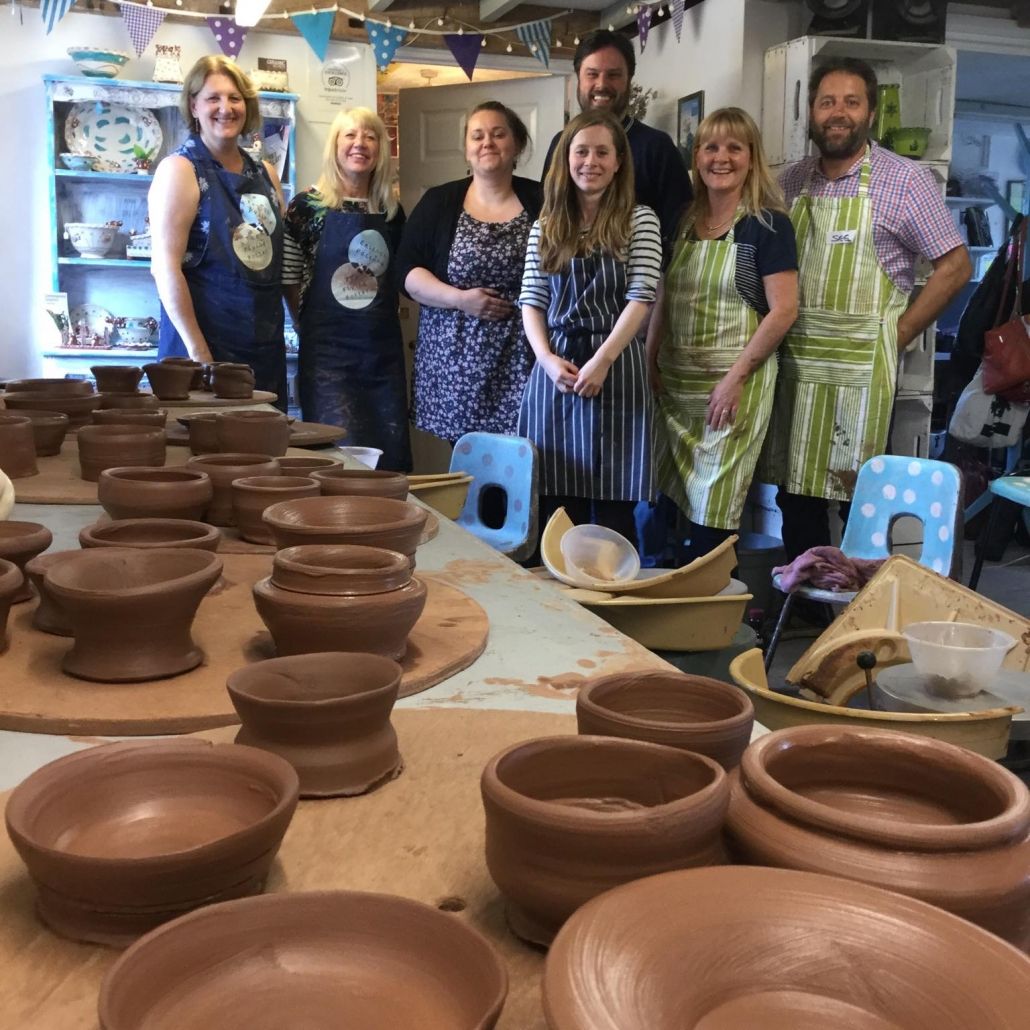 terracotta pots made by participants on a one day potter's wheel course at eastnor pottery