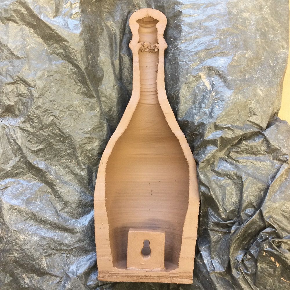 inside the halved terracotta bottle