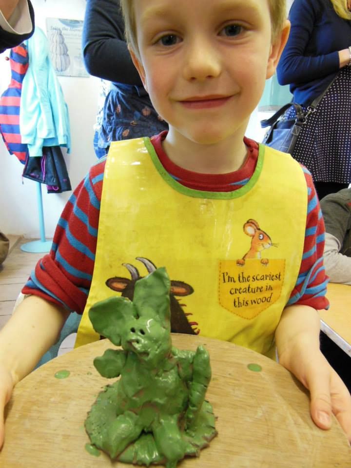 child with green rabbit made at eastnor pottery