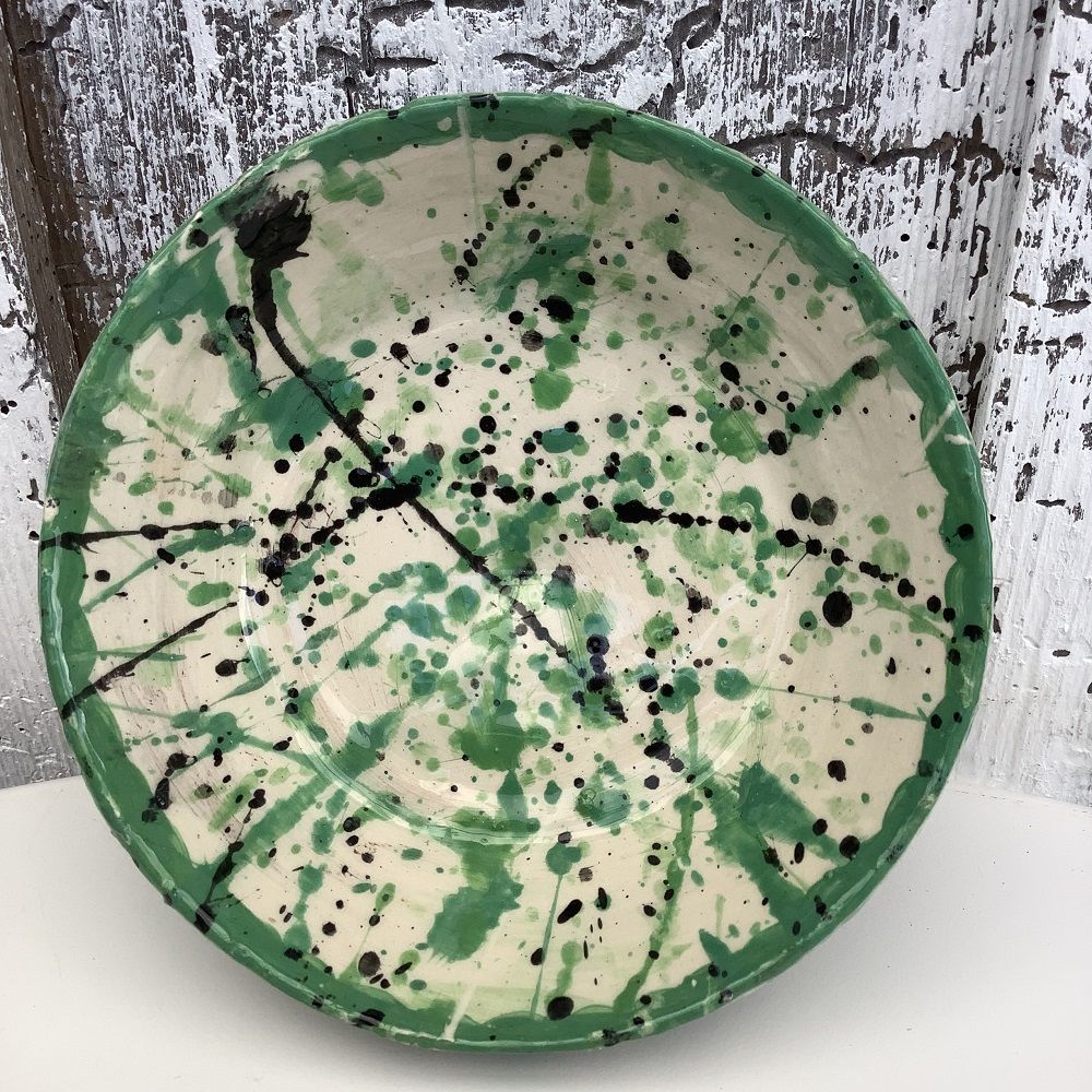 plate painted white with green and blue splatters