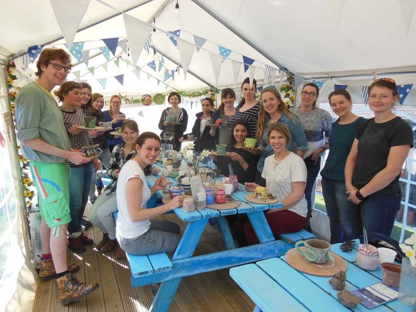 group of girls celebrate hen party by making pottery at eastnor pottery in herefordshire