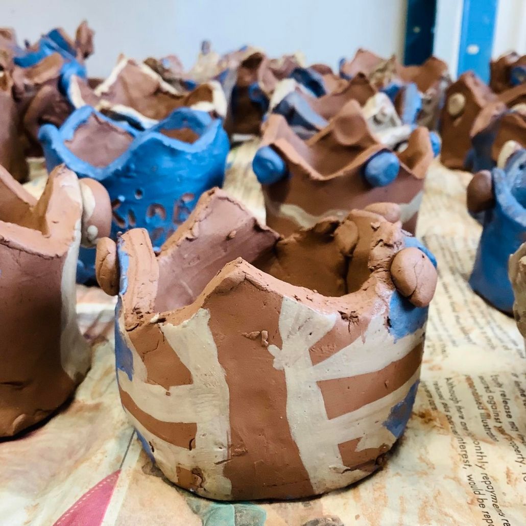 clay crown made by a primary school student at madresfield primary school decorated in red white and blue slip